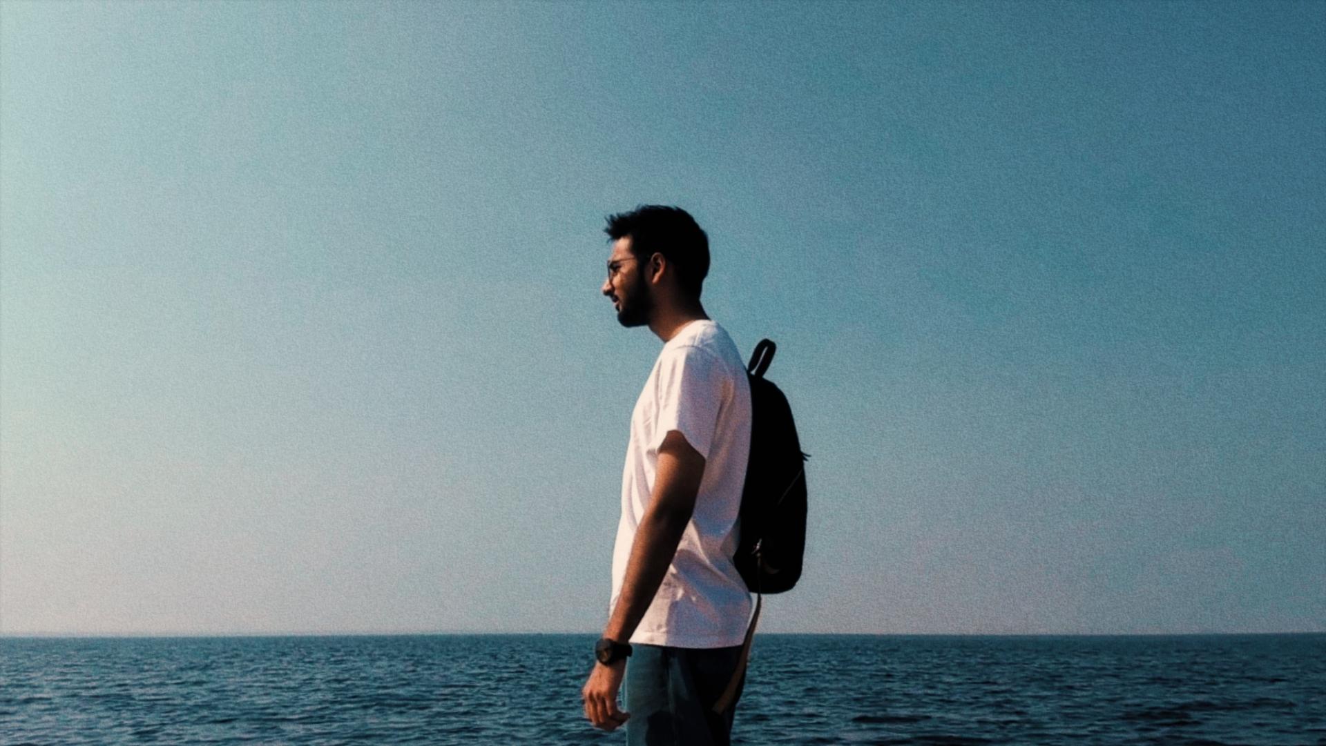 Mohammad Zaid standing by the sea